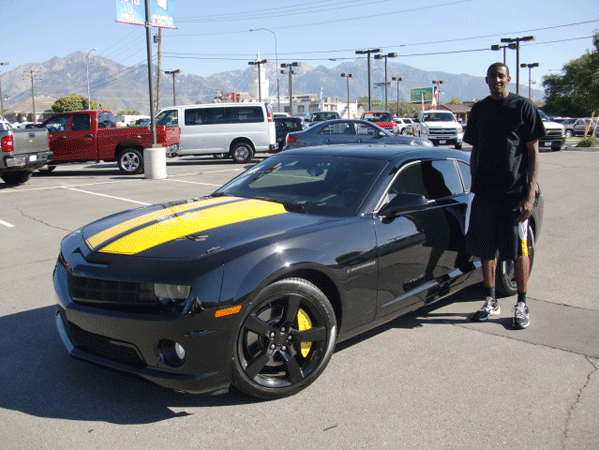 Jeremy Evans with his customized Chevy Camaro in Murray