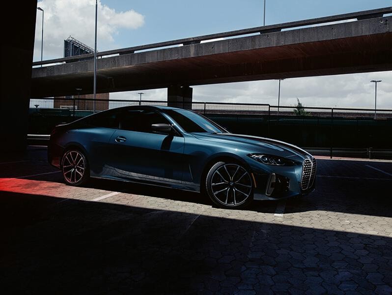 2021 BMW 4Series Coupe Sideshot Passenger Side Under A Bridge 