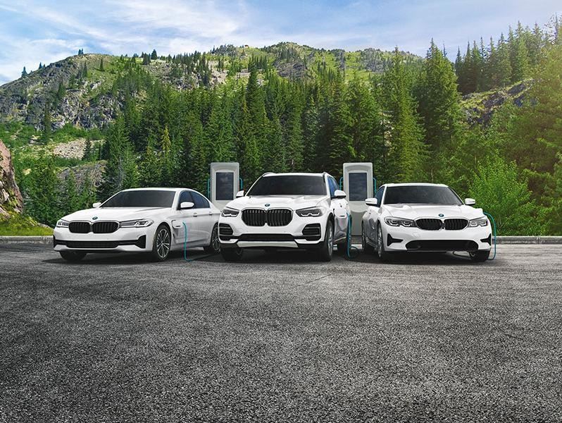 BMW Plug-In Hybrids parked in front of mountain
