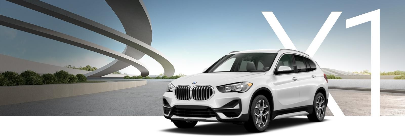 A white BMW X1 on a modern landscape.