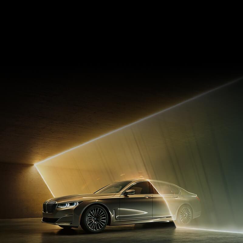 BMW 7 Series driving through a wall of light beams
