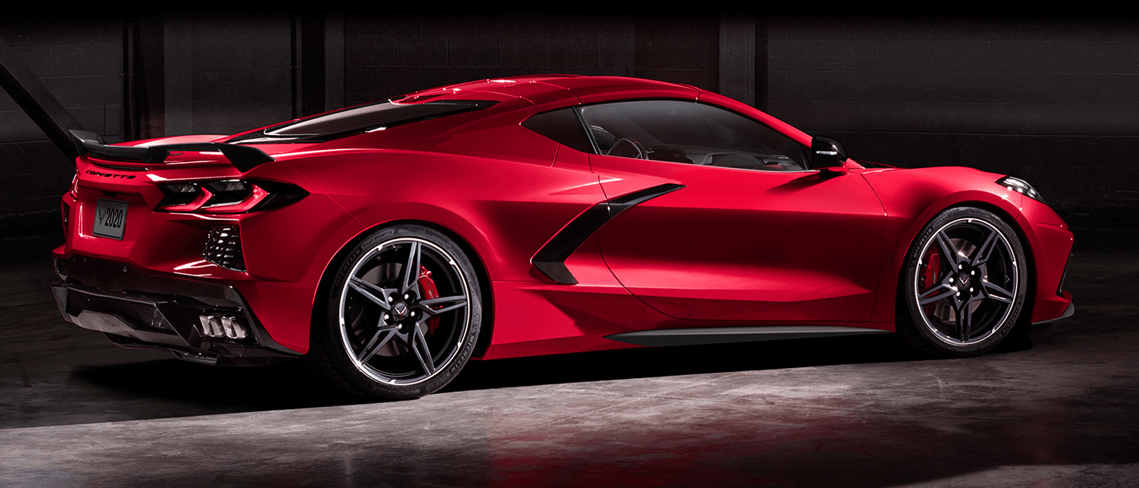 Rear thre-quarter exterior view of the all-new 2020 Chevy Corvette finished in Torch Red.