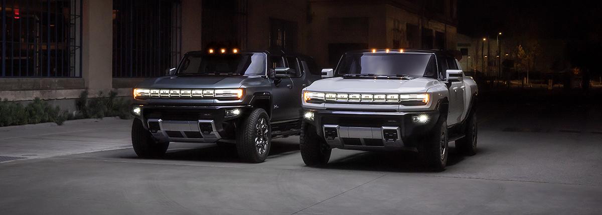 Two 2022 Hummer EV parked side by side