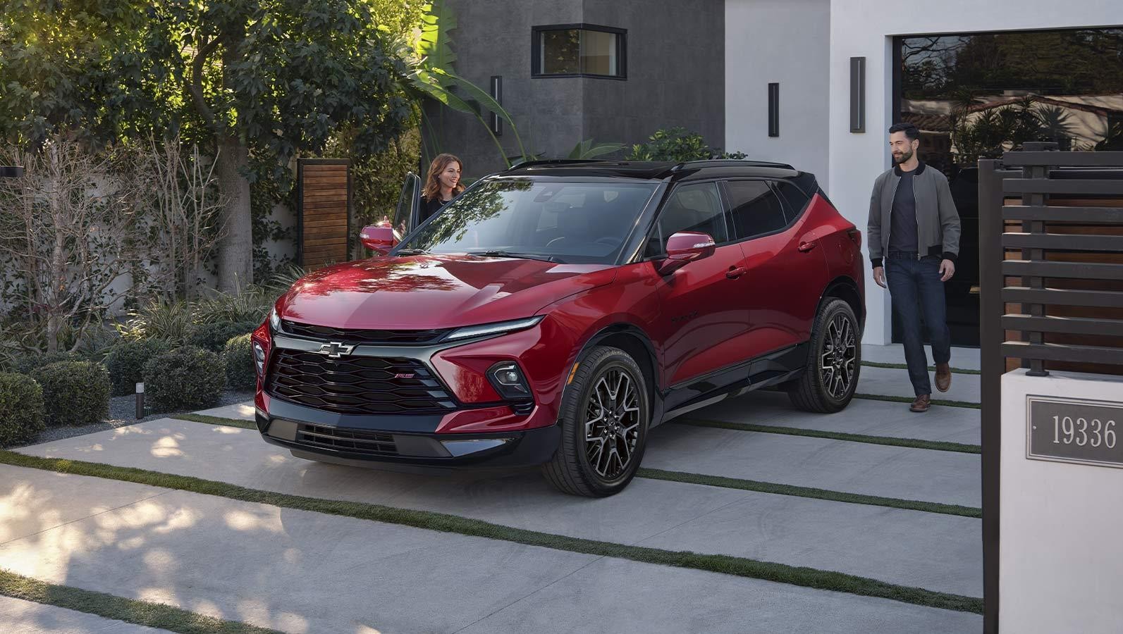 2024 Chevrolet Blazer parked in front of house. 2024 Chevrolet Blazer parked in front of house.