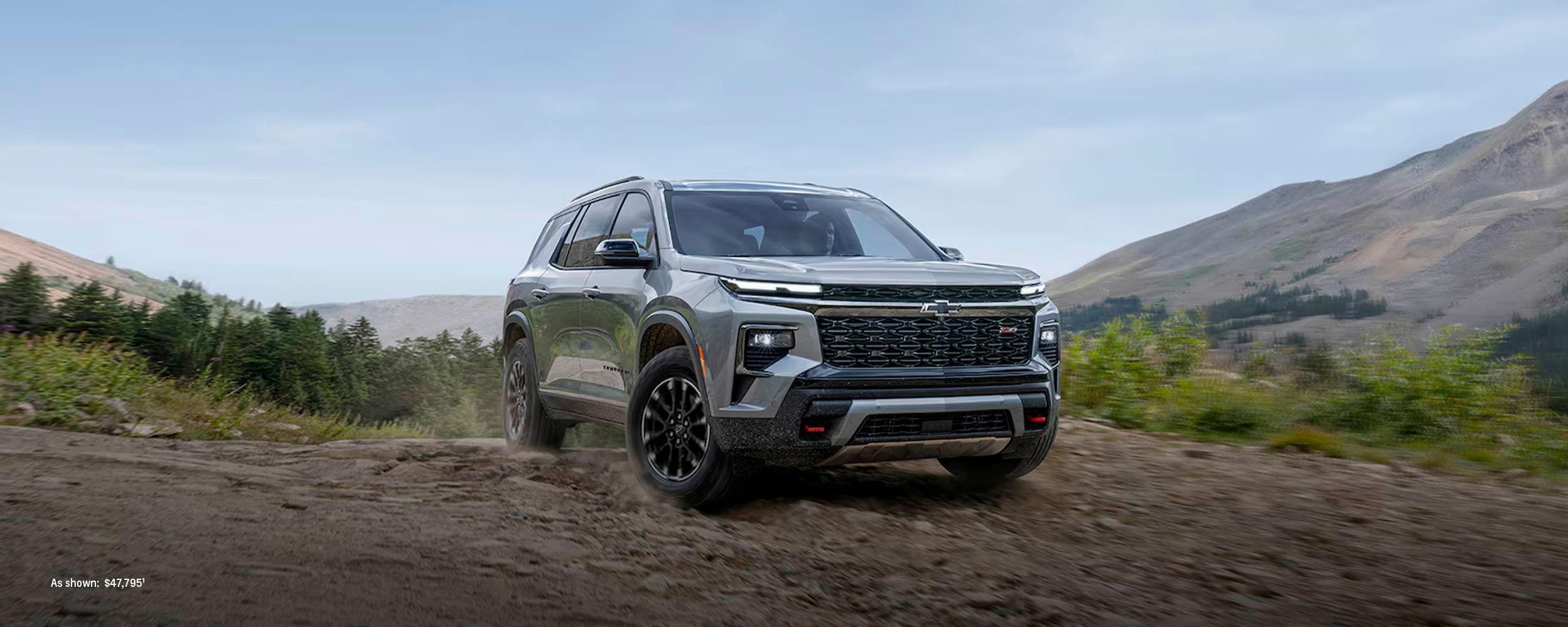 2024 Chevrolet Traverse sprinting in mountain area. 2024 Chevrolet Traverse sprinting in mountain area.