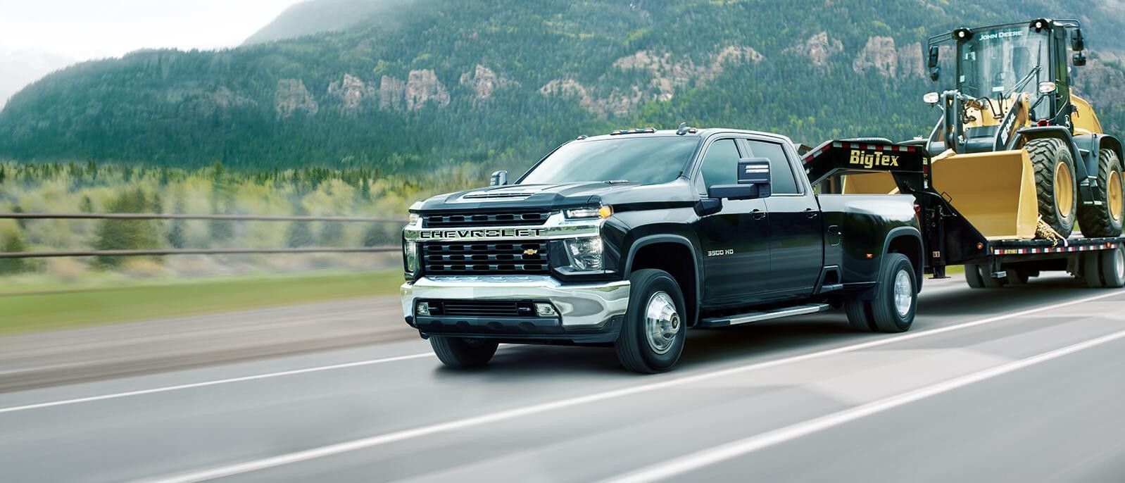 2021 Chevy Silverado 3500HD towing a truck.