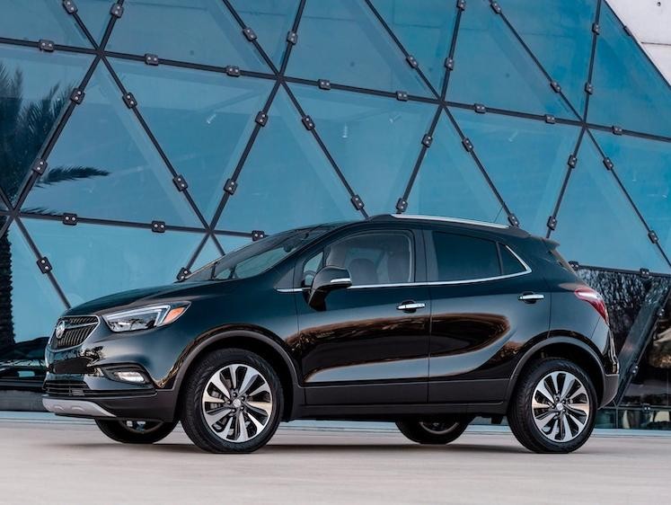2020 Buick Encore Small Luxury SUV: side profile view with a woman walking