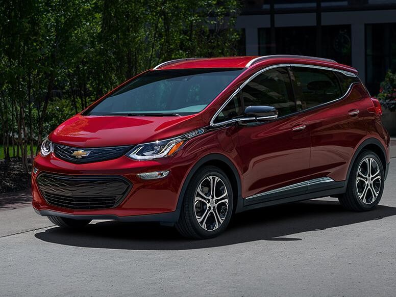 2021 Chevy Bolt Ev parked in front of a house.