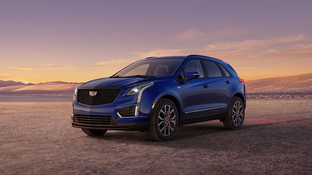 The 2024 Cadillac XT5 Parked in a Mountainous Landscape During a Sunset The 2024 Cadillac XT5 Parked in a Mountainous Landscape During a Sunset