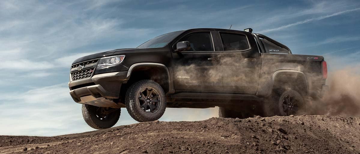 Chevrolet Colorado bounding over a hill