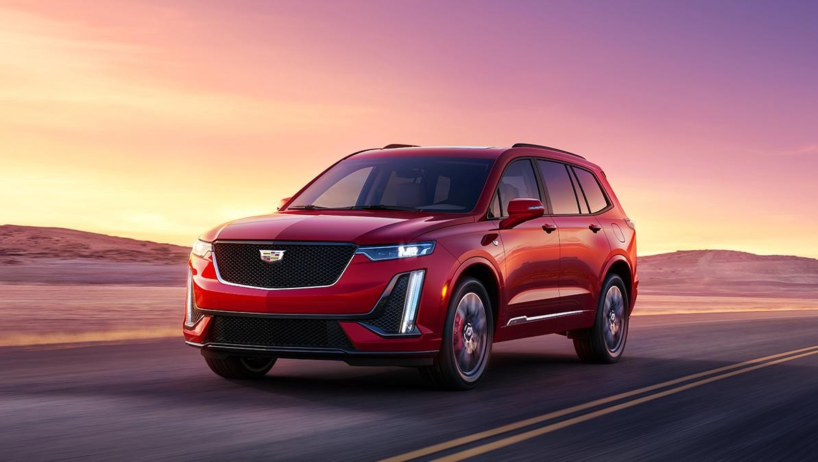 The Cadillac XT6 Driving on an Open Road in the Desert During Sunset The Cadillac XT6 Driving on an Open Road in the Desert During Sunset