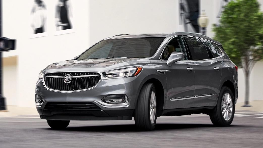 Buick Enclave turning on a intersection facing towards the camera