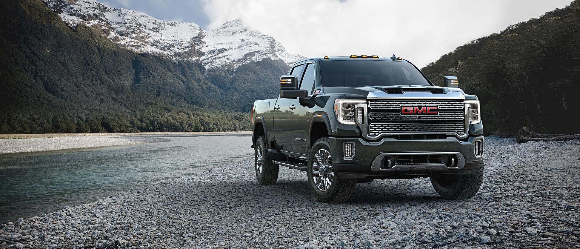 A 2024 GMC Sierra HD parked near a river. A 2024 GMC Sierra HD parked near a river.