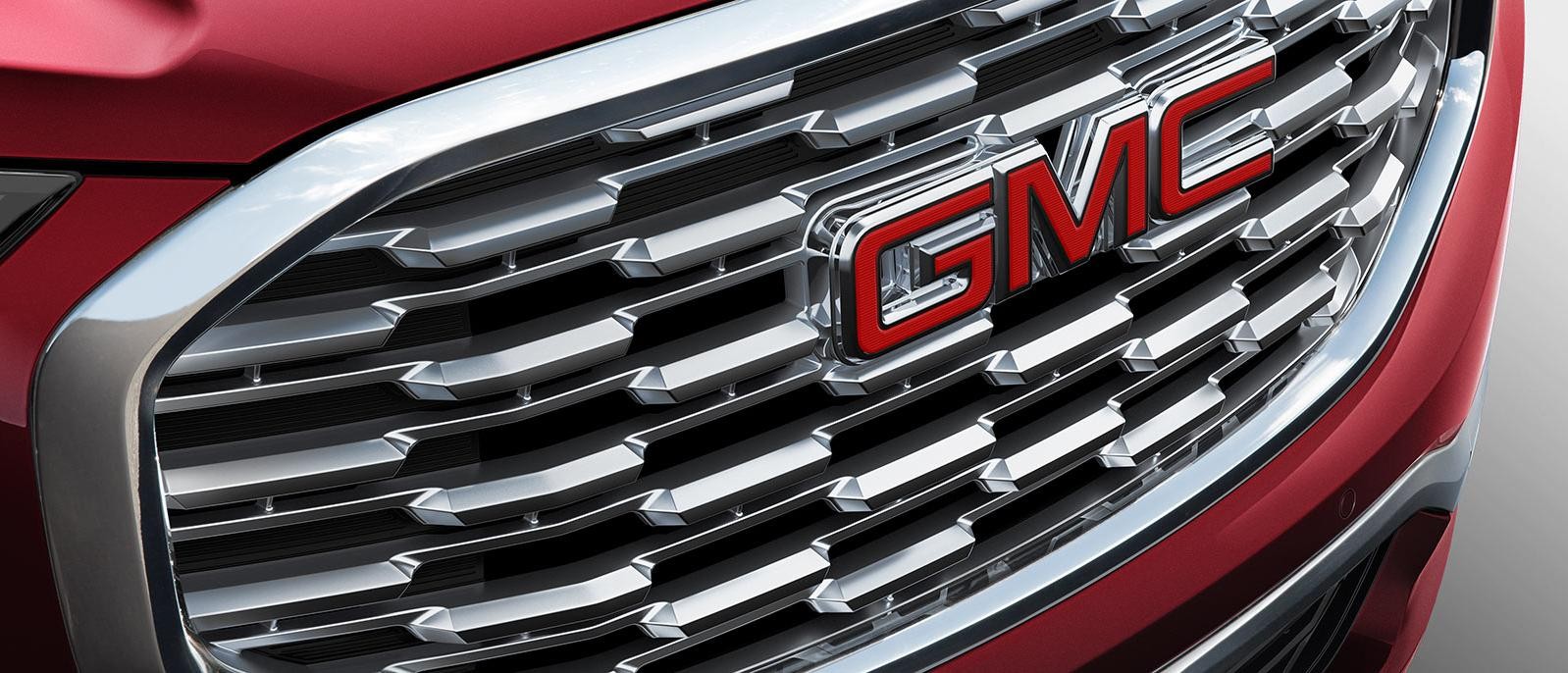 Close up of a GMC Denali Grille featuring the logo. Close up of a GMC Denali Grille featuring the logo.