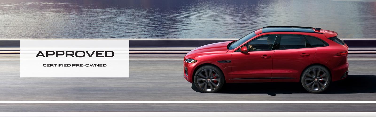 2021 F-PACE driving near a lake