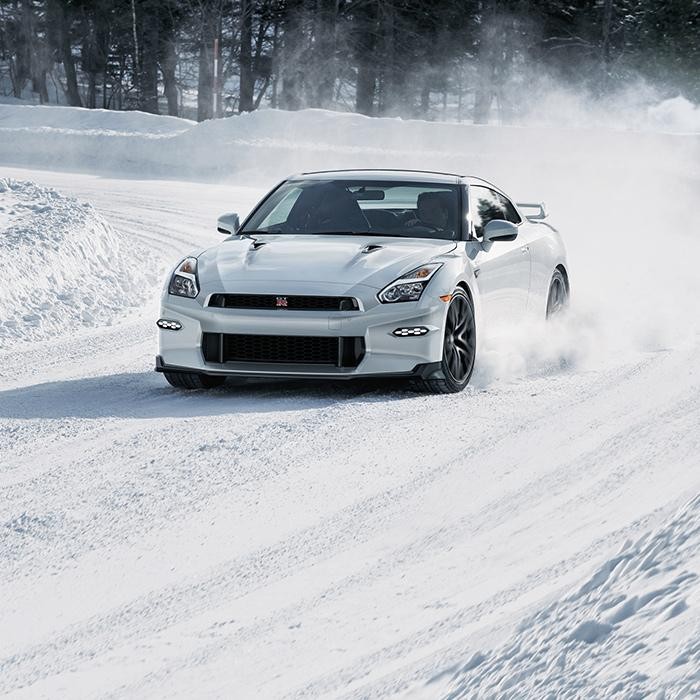 2024 Nissan GT-R sprinting in the snow region.