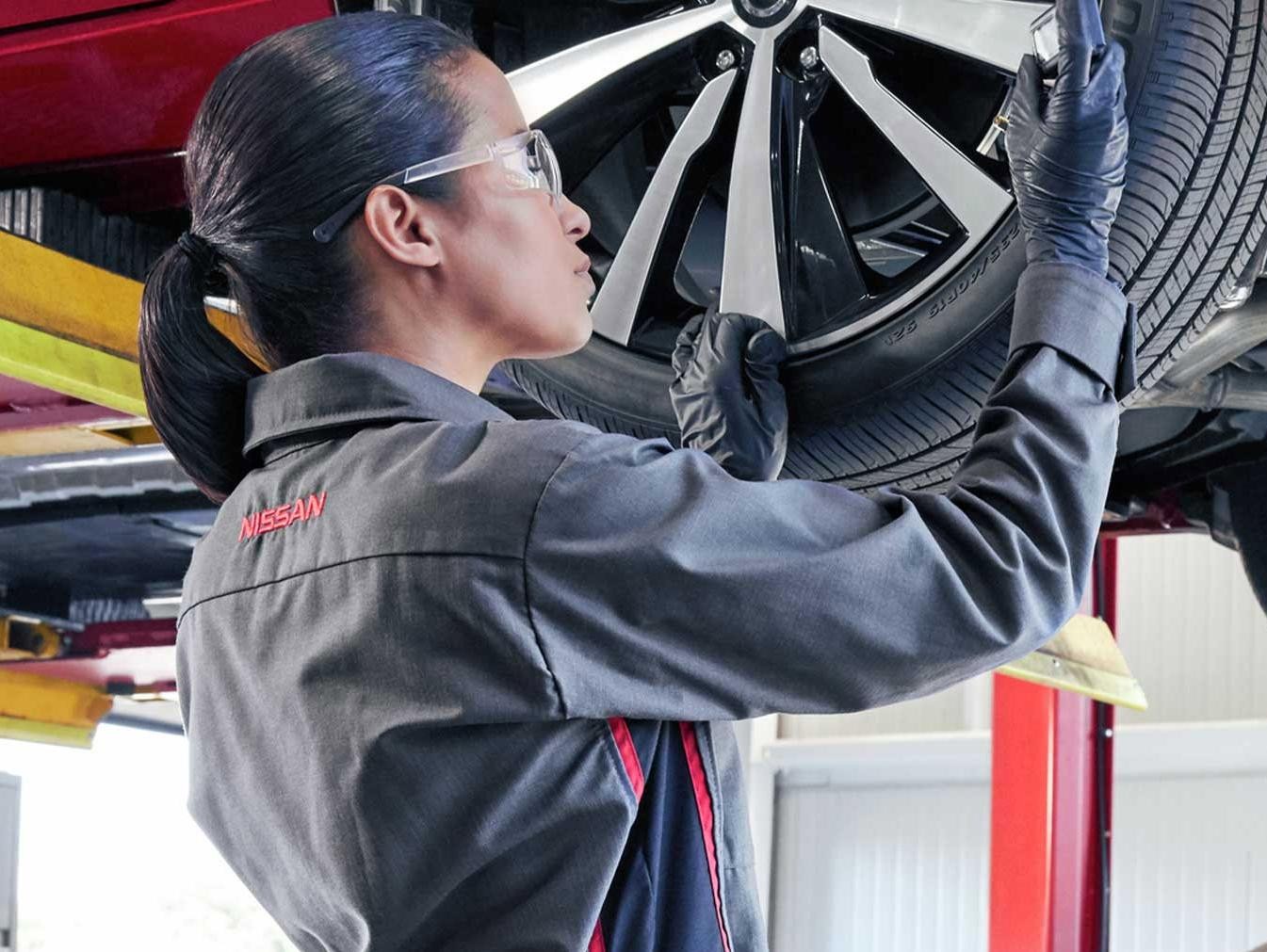 Nissan Technician Filling up a Tire