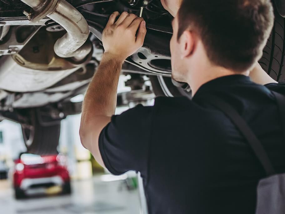 Service mechanics working on a vehicle