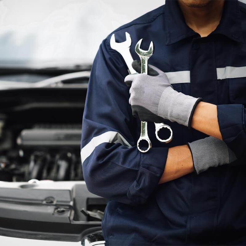 Service technician with a wrench in hand