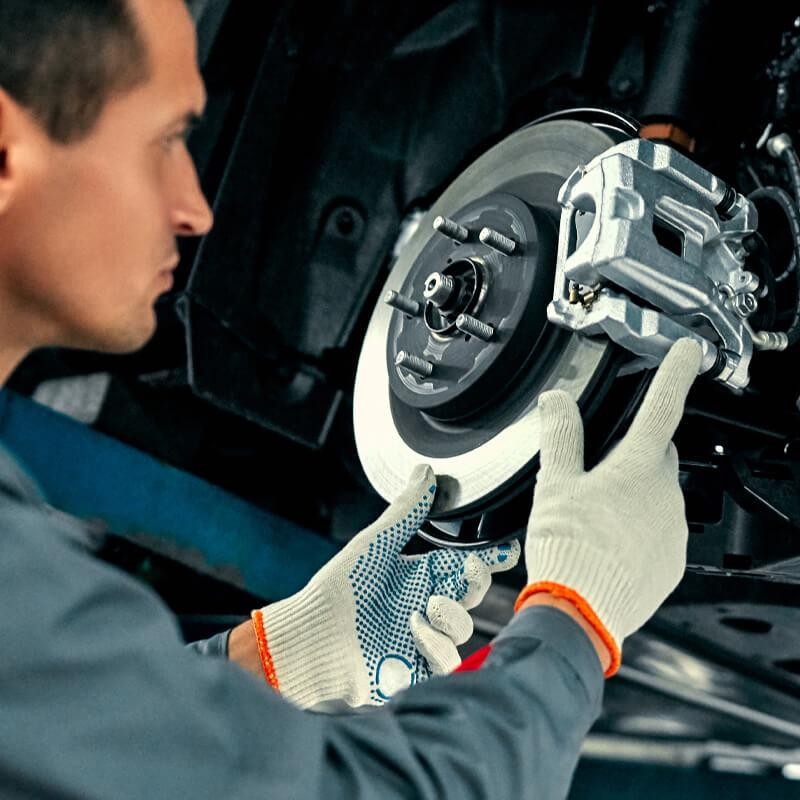 Technician changing car parts