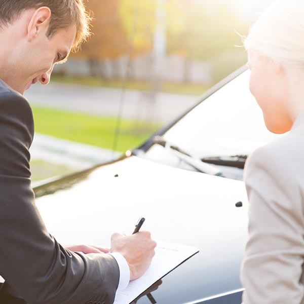 Man signing a finance application