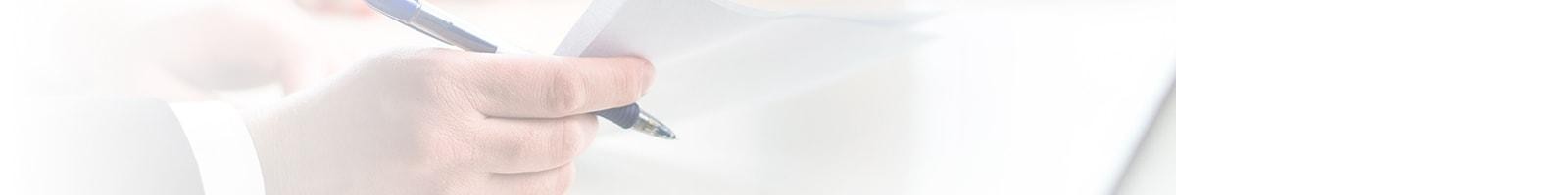 Finance manager showing a couple their finance documents