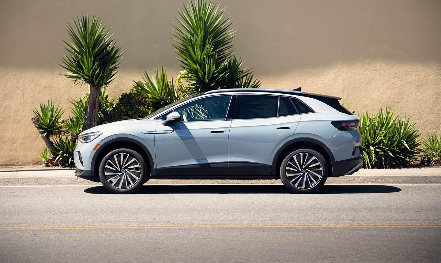 ID.4 AWD Pro S Plus shown in Arctic Blue Metallic parked next to a sidewalk.