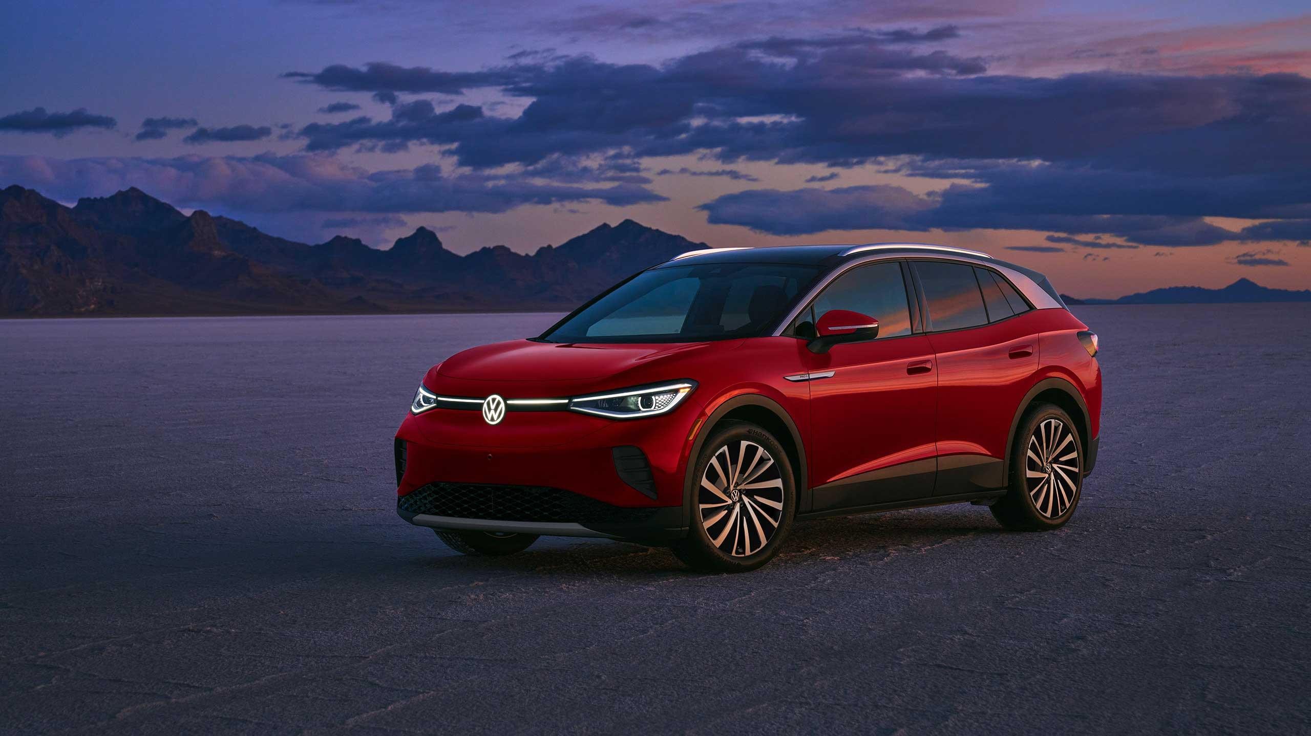 A ¾ front of an ID.4 in Dusk Blue Metallic in a natural sunset setting.