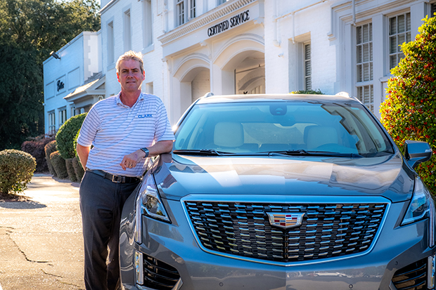 Troy Clark with Cadillac vehicle