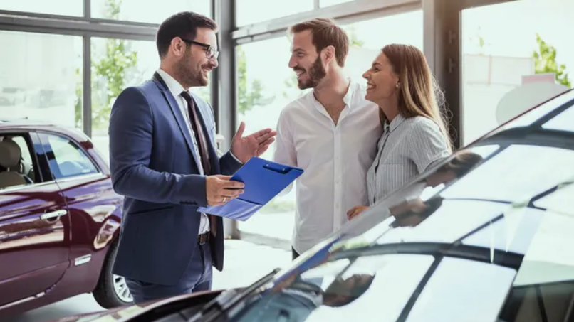3 People standing next to a car
