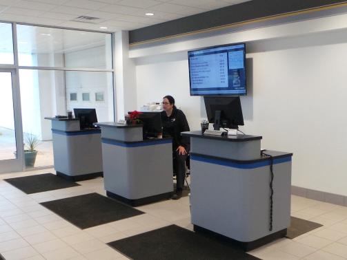 Customer shaking hands with a dealership sales associate