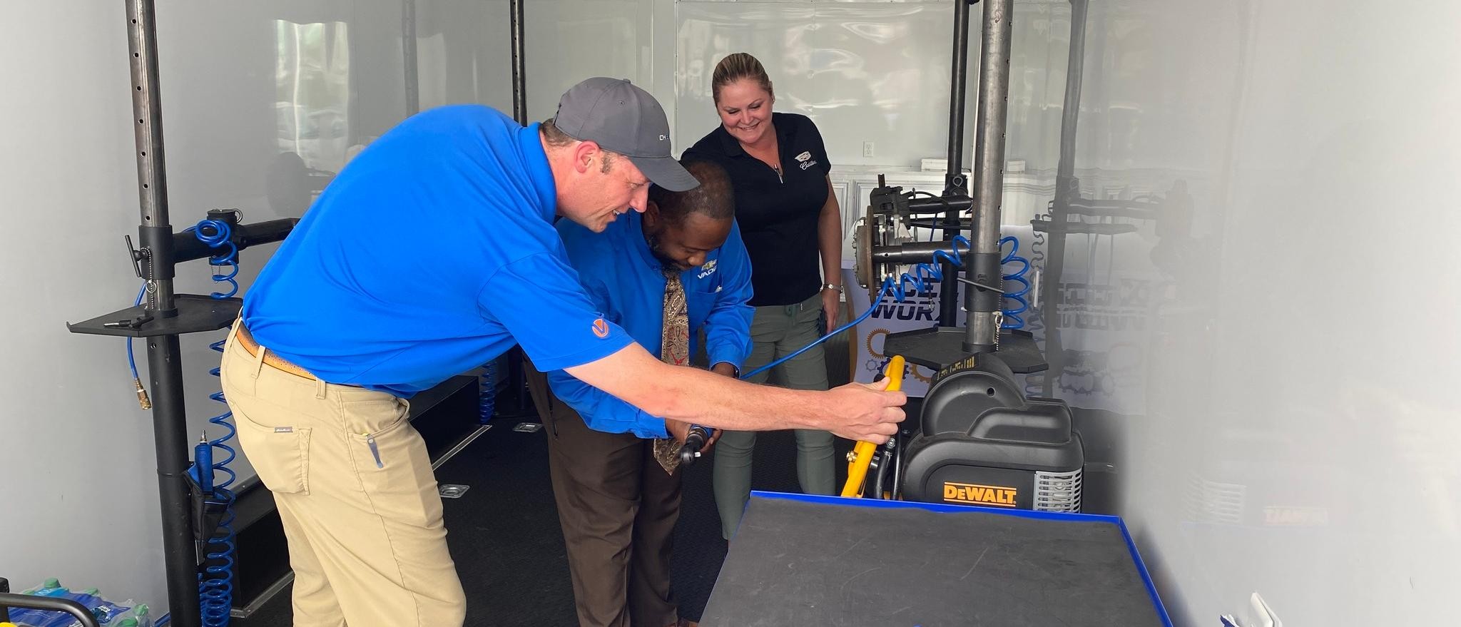 Xcel Team member demonstrating with a Regional Director in the Xcel Mobile Unit 