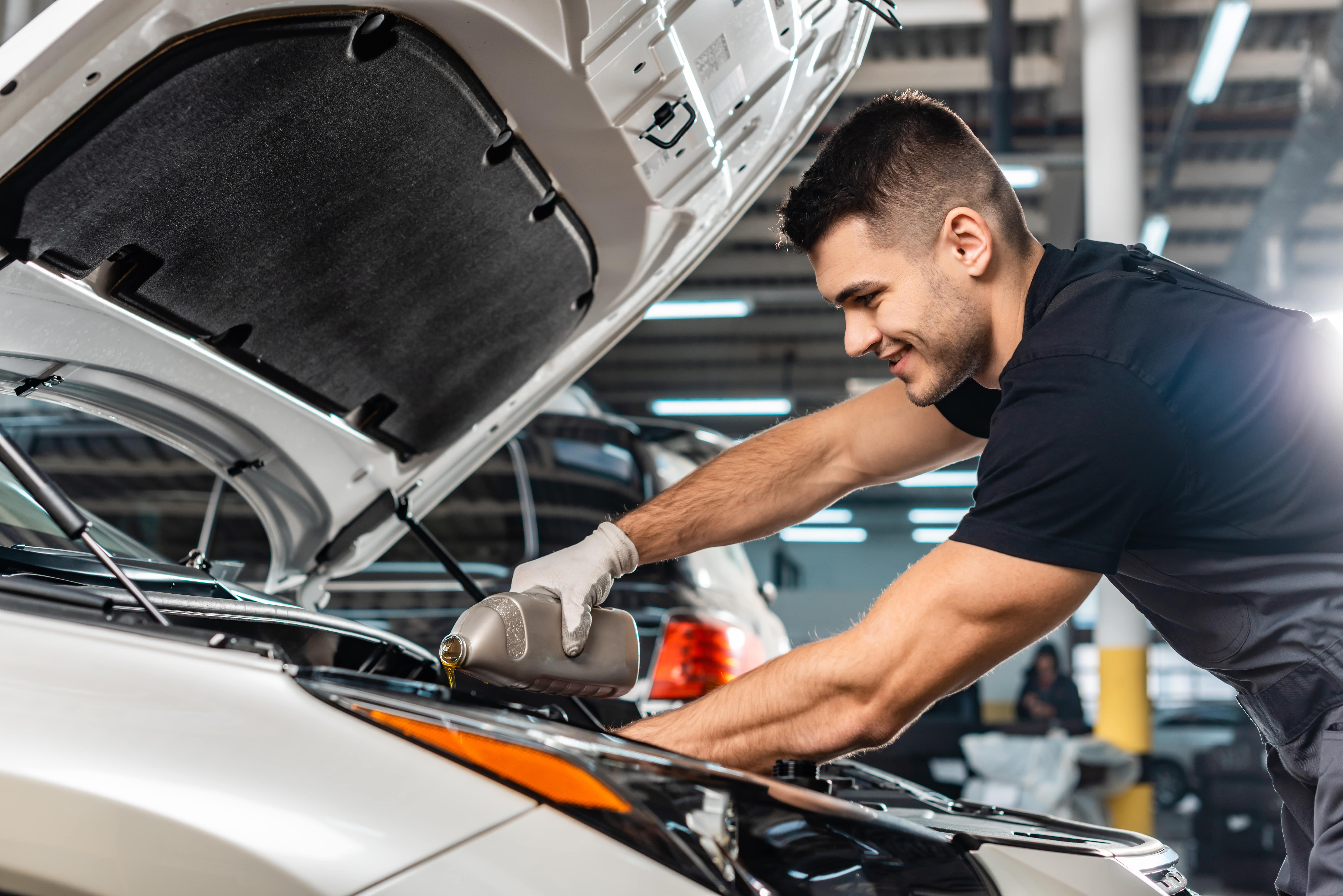 Mechanic performing an oil change on a 2025 Buick Envista