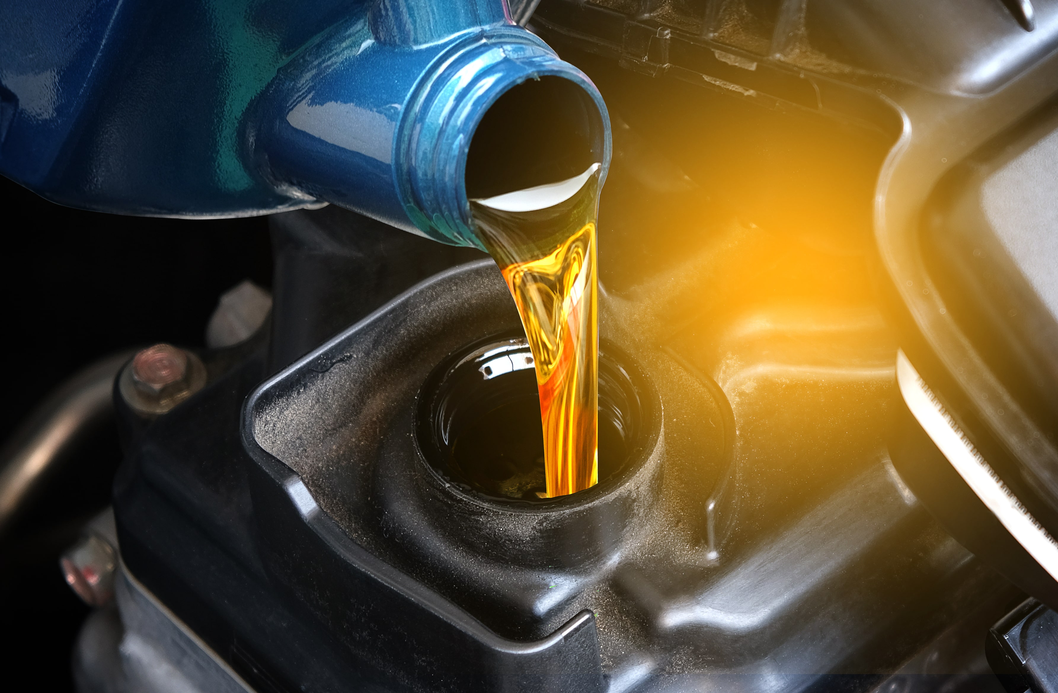 mechanic adding oil to a 2025 Buick Encore GX