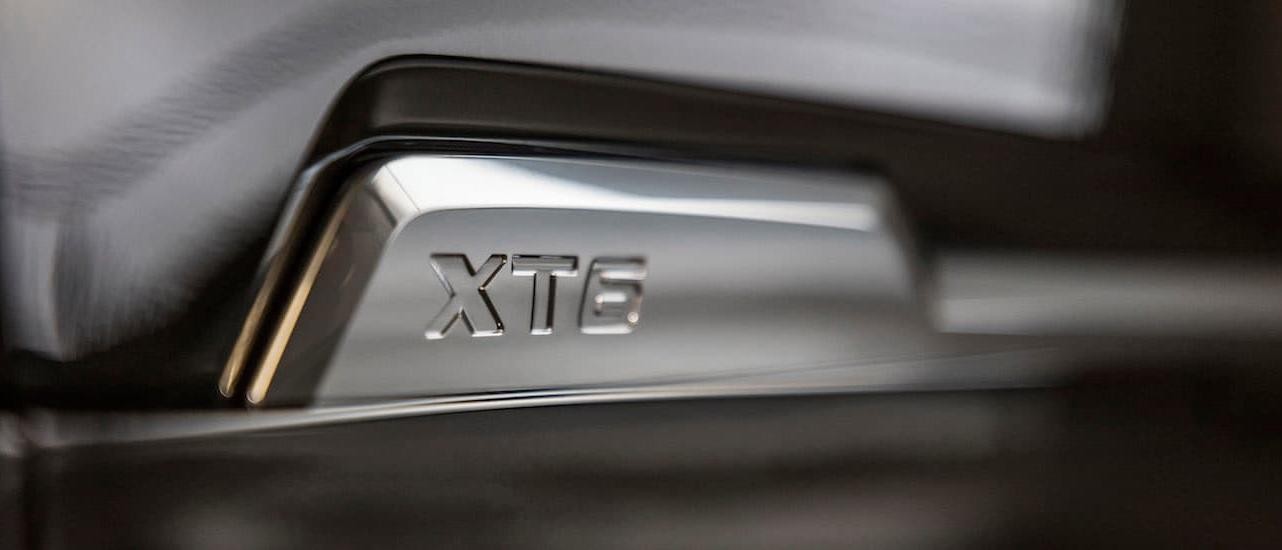 A closeup of the XT6 badging on a 2020 Cadillac XT6