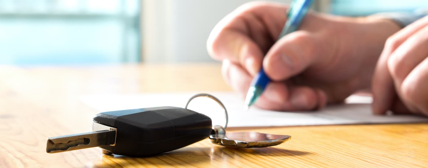A set of keys are set on a table during a GM lease turn in.