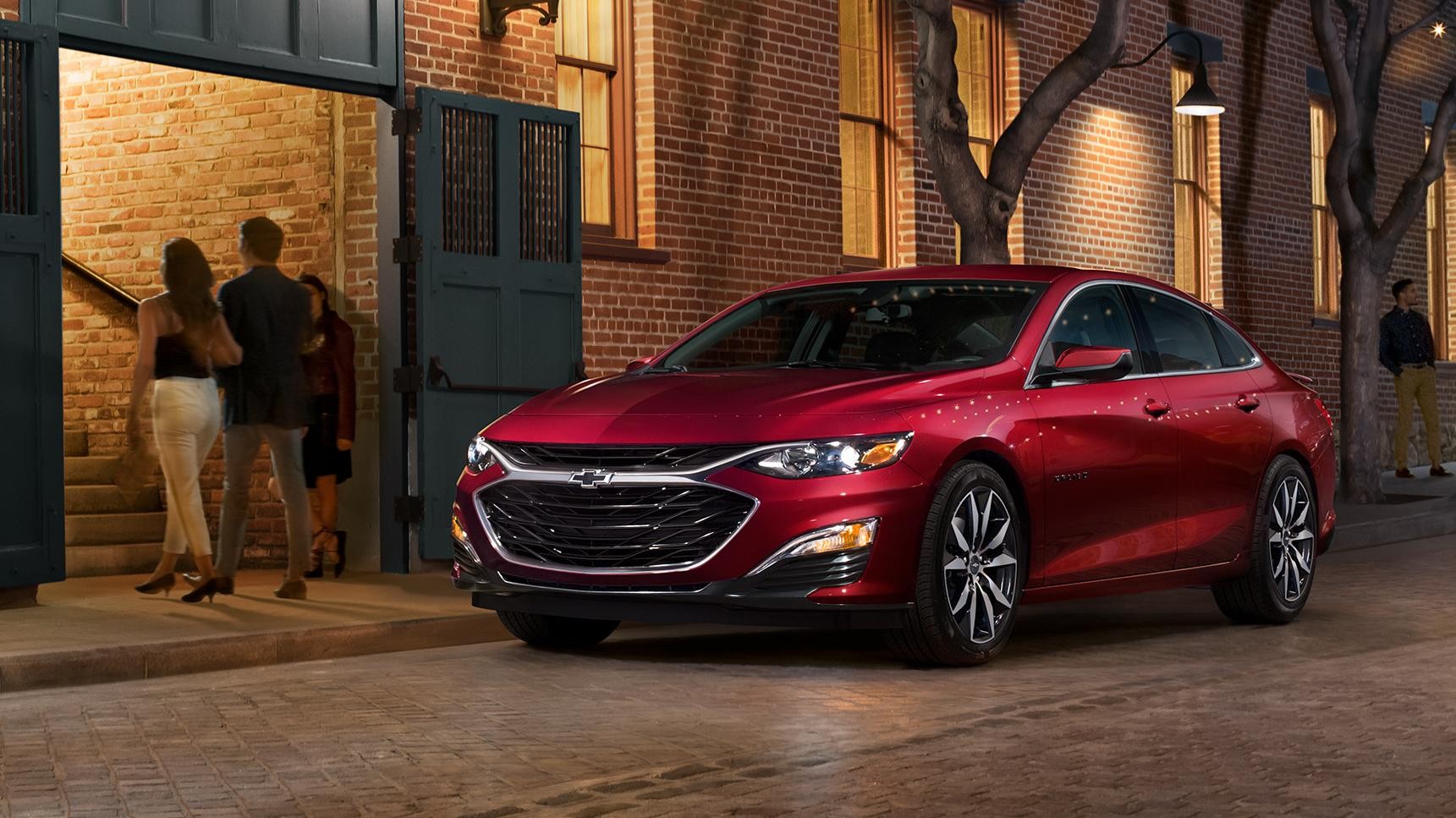 2021_Chevrolet_Malibu_RS_Life_Cherry!Red_Right_Scenic,Building