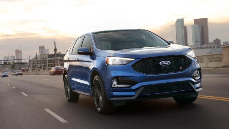 2019 Blue Ford Edge Driving Out Of The City