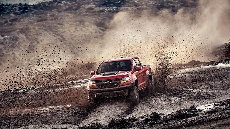 2019 Red Chevy Colorado Driving in Mud Off-Road
