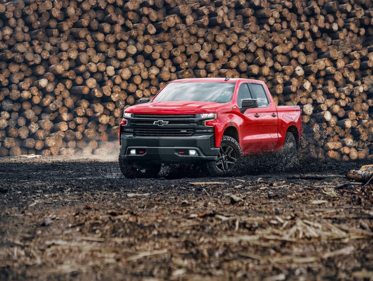 Red 2019 Chevy Silverado 1500 Driving Through Mud