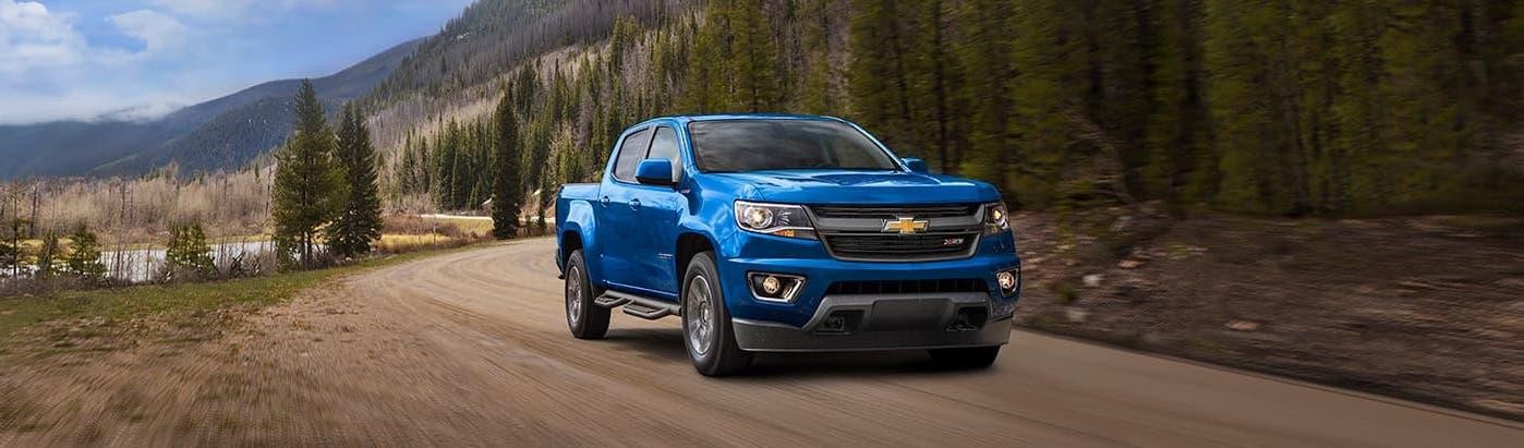 2019 Blue Chevy Colorado Z71 Driving Through Mountains