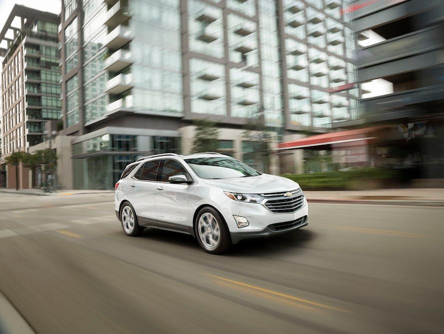 2019 White Chevy Equinox Driving in the City
