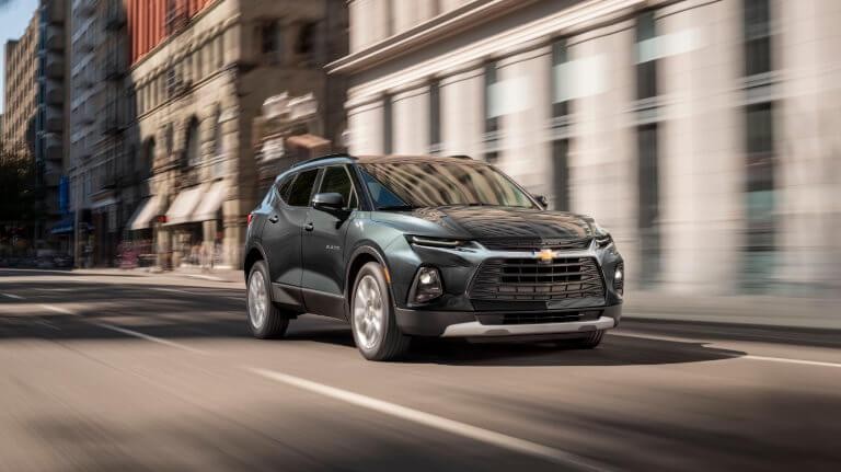 2019 Green Chevy Blazer Driving Down City Street Motion Blurr
