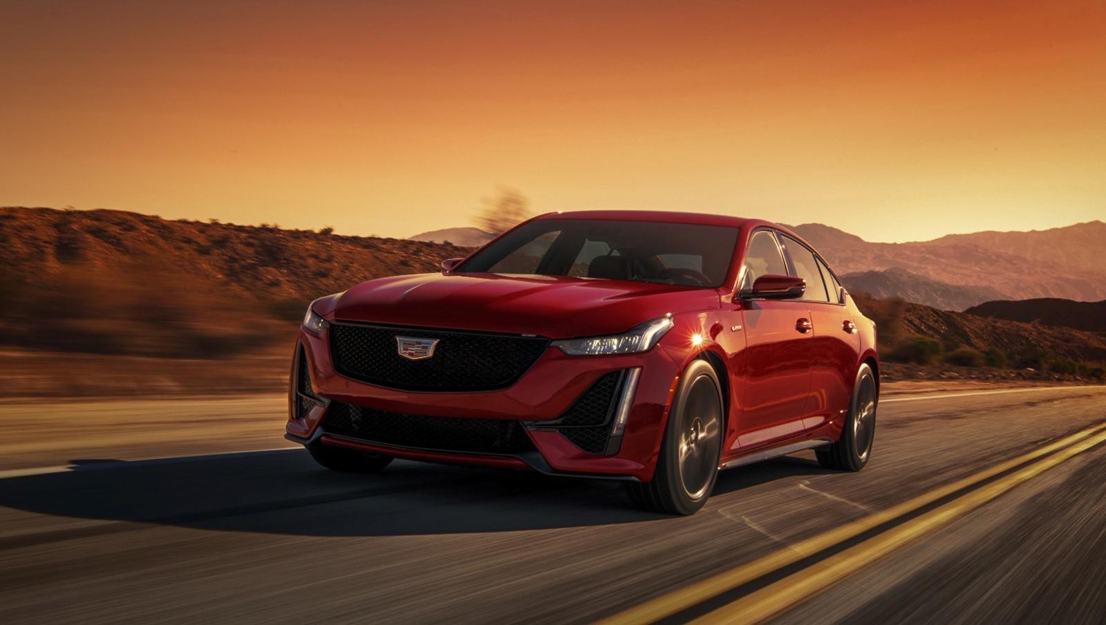 3/4 drivers side front view of vehicle in motion; 3/4 drivers side front view of vehicle in motion