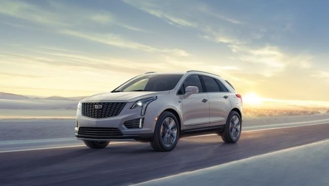 White 2025 Cadillac XT5  with a desert background