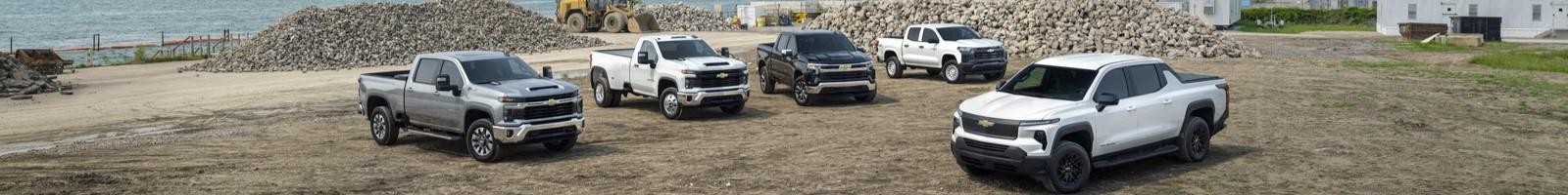 Silverado 1500 Crew Cab LT Short Bed with Z71 and 20" wheels in Black; Silverado 2500 HD Custom Standard Bed with Z71 in Sterling Gray Metallic; Silverado 3500 HD Regular Cab Long Bed DRW in Summit White Colorado Crew Cab WT in Summit White; Silverado EV WT in Summit White.