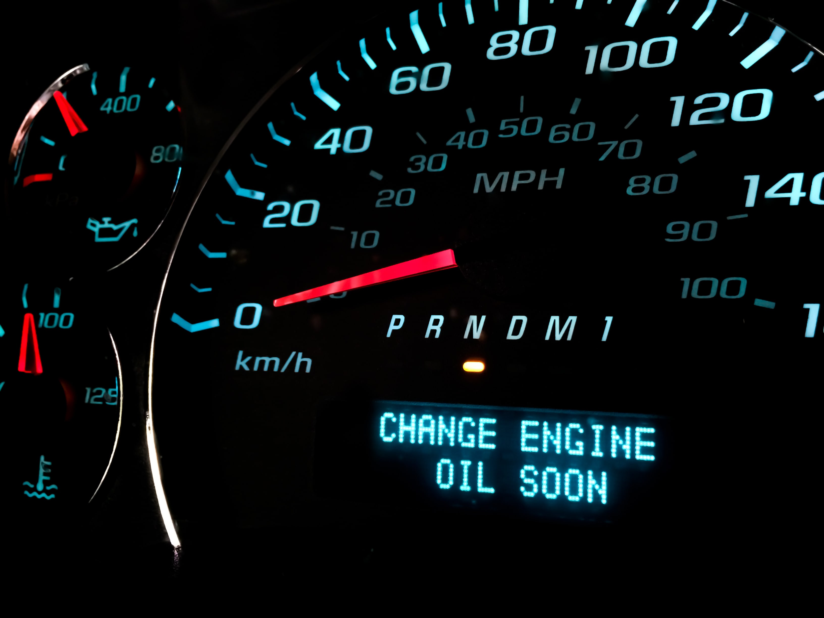Speedometer with "change engine oil soon" light activated