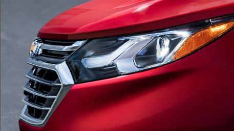 Salesman showing a customer information on a tablet.