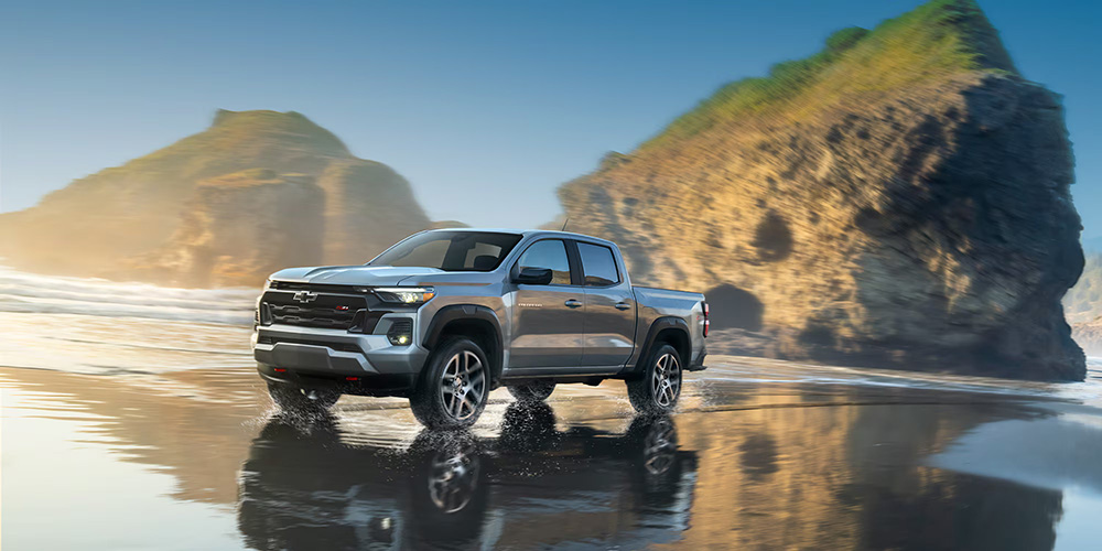 2025 Chevy Colorado pickup truck driving on a beach