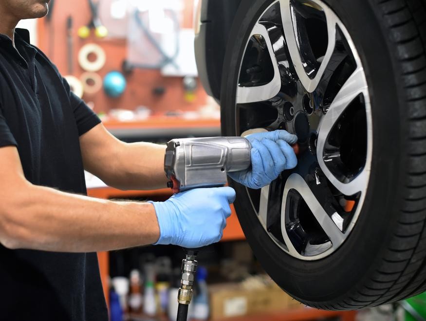 Mechanic working on a car tire